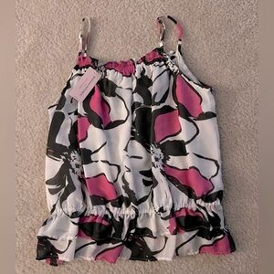 Flowy top with ruffled bottom. Pink, black and white. New with tag.
